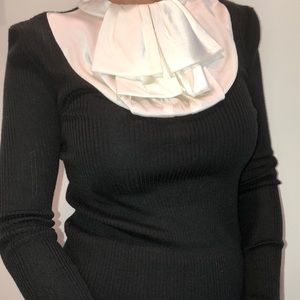 Black top with with silk frill.